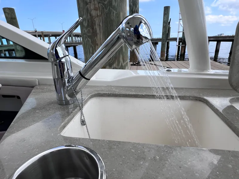 Slide: The Image of Boston Whaler 320 Vantage 2022 boat sink with running water, dockside view. - 36