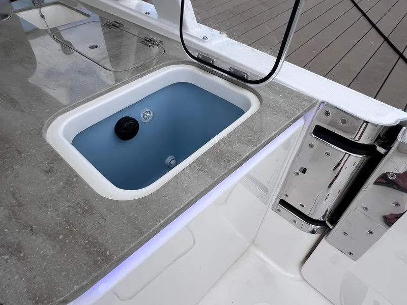 Slide: The Image of 2022 Boston Whaler 320 Vantage boat sink and countertop detail. - 37