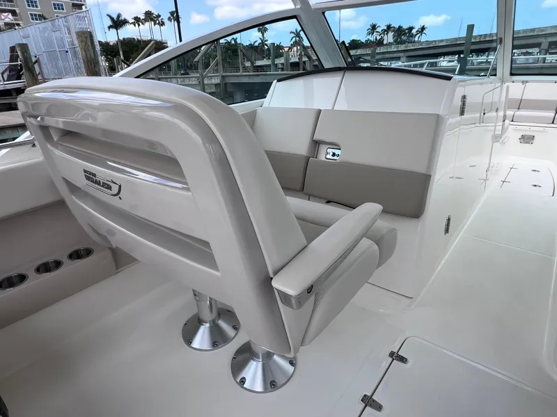 Slide: The Image of 2022 Boston Whaler 320 Vantage boat interior with joystick control, featuring sleek seating. - 38