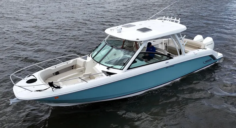 Slide: The Image of 2022 Boston Whaler 320 Vantage boat on water, featuring joystick control, mint condition. - 4