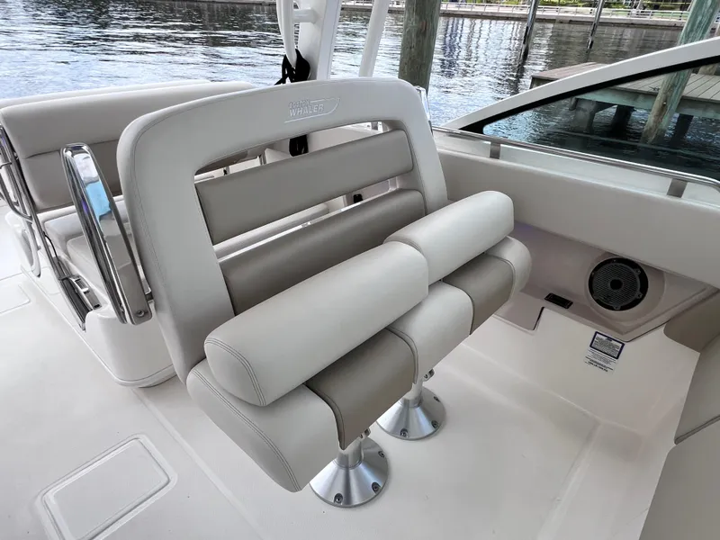 Slide: The Image of 2022 Boston Whaler 320 Vantage boat interior with plush seating and joystick control. - 40
