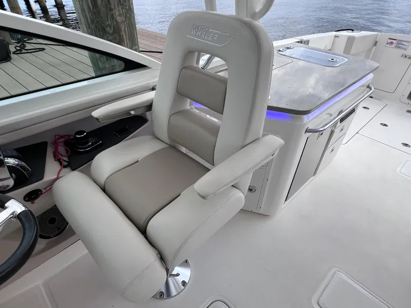 Slide: The Image of 2022 Boston Whaler 320 Vantage boat interior with joystick control and luxurious seating. - 44
