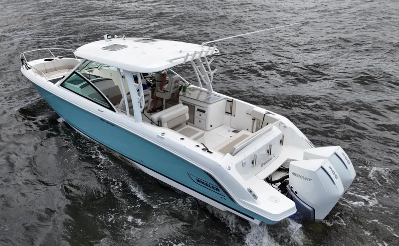 Slide: The Image of 2022 Boston Whaler 320 Vantage boat on water, featuring joystick control and twin engines. - 7