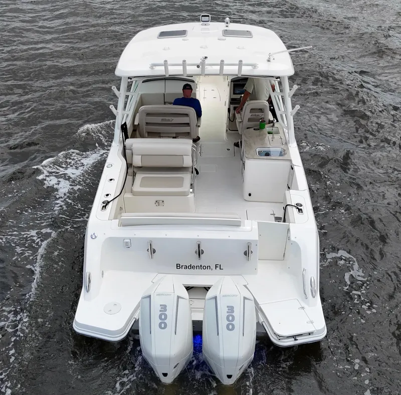 Slide: The Image of 2022 Boston Whaler 320 Vantage boat with dual engines, cruising in Bradenton, FL. - 8