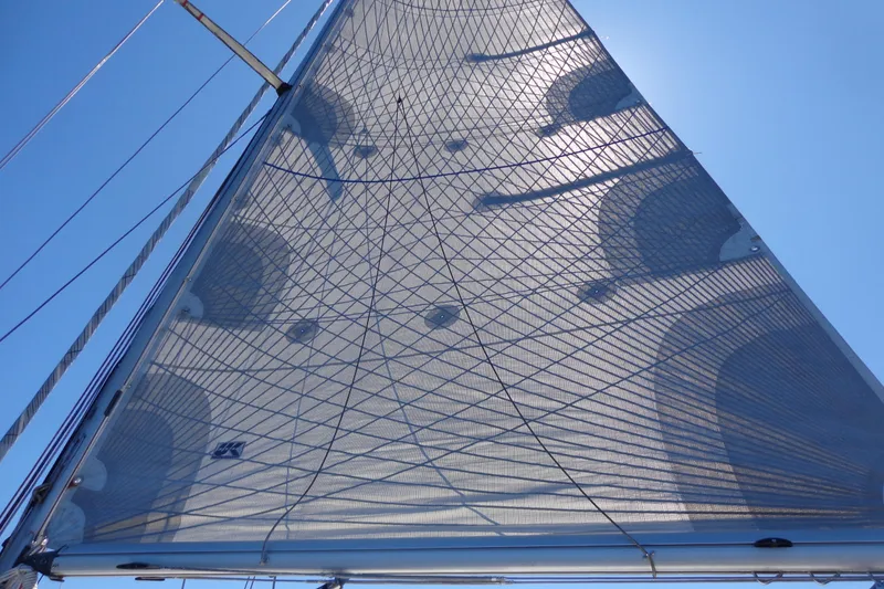 Slide: The Image of Sail of 1985 Wauquiez Pretorien Masthead against clear blue sky. - 14
