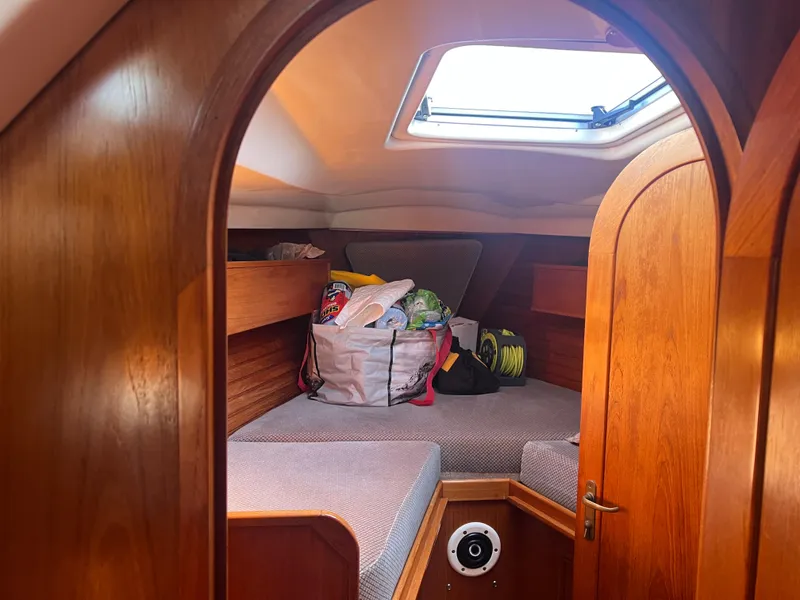Slide: The Image of Cozy cabin interior of 1985 Wauquiez Pretorian Sloop with skylight and wooden finish. - 29