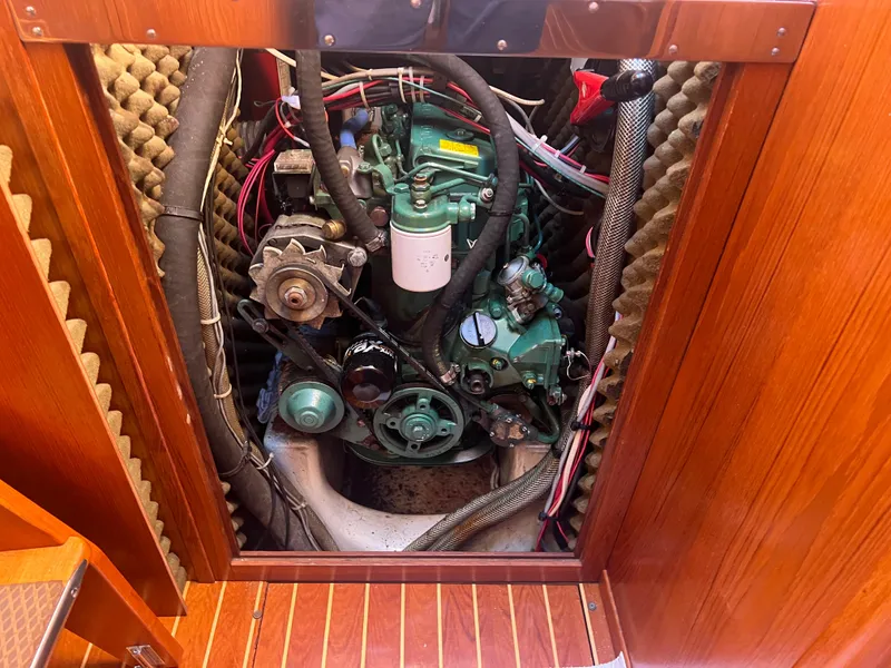 Slide: The Image of Engine compartment of a 1985 Wauquiez Pretorian Sloop, showcasing mechanical components and wiring. - 31