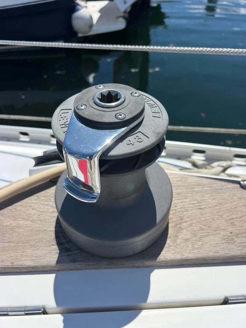 Slide: The Image of Winch on 1985 Wauquiez Pretorien Sloop sailboat, docked by the water. - 35