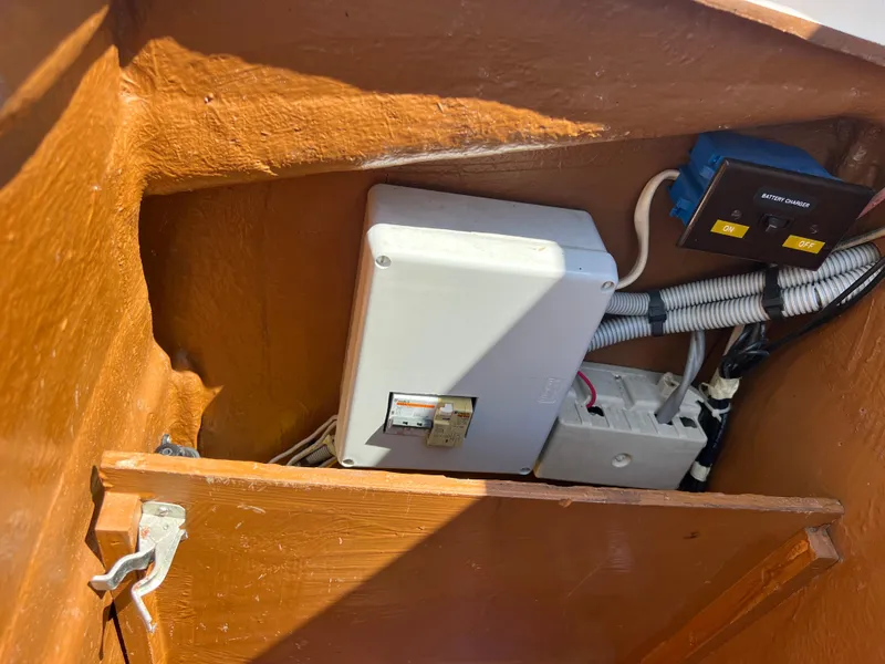 Slide: The Image of Electrical panel inside 1985 Wauquiez Pretorien Sloop, featuring wiring and components. - 36