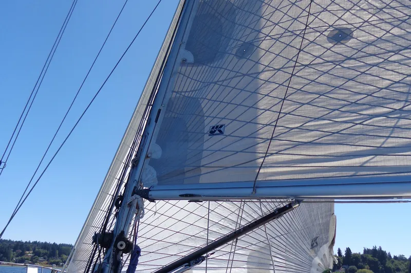 Slide: The Image of Sail of 1985 Wauquiez Pretorien Masthead yacht against clear blue sky. - 43
