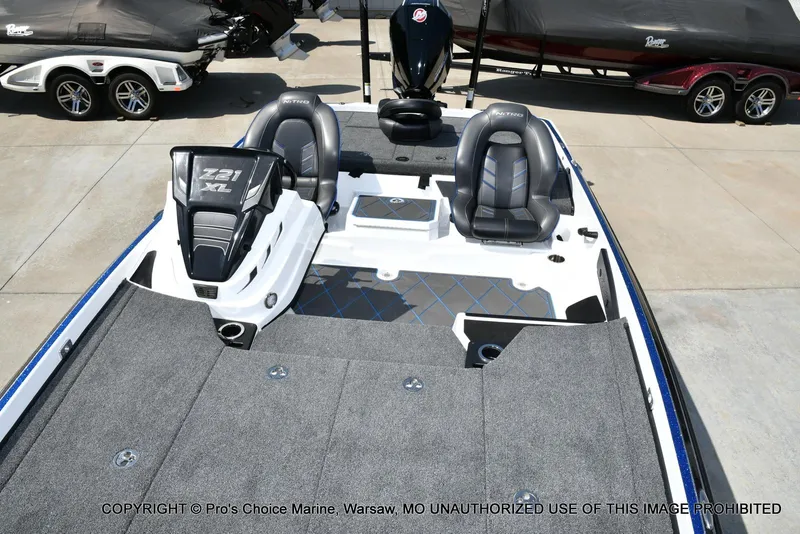 Slide: The Image of 2023 Nitro Z21 XL Pro boat interior with dual seats and spacious deck. - 14