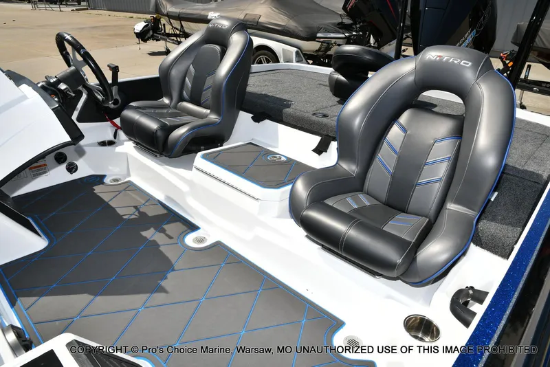 Slide: The Image of 2023 Nitro Z21 XL Pro boat interior with sleek black and blue seating. - 17