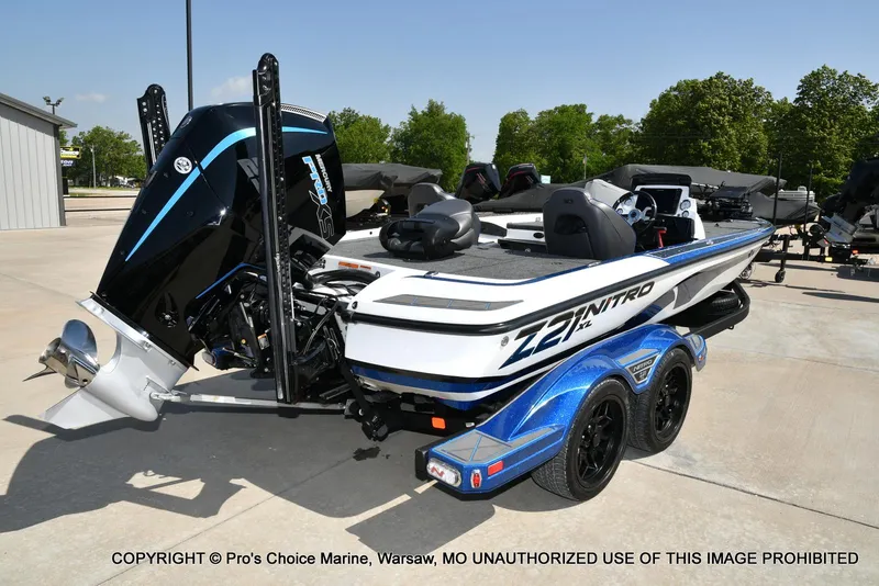Slide: The Image of 2023 Nitro Z21 XL Pro boat with powerful engine, parked on a trailer. - 20