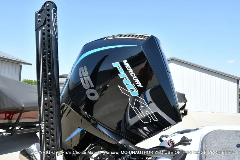 Slide: The Image of 2023 Nitro Z21 XL Pro with Mercury Pro XS 250 engine, outdoor setting. - 23