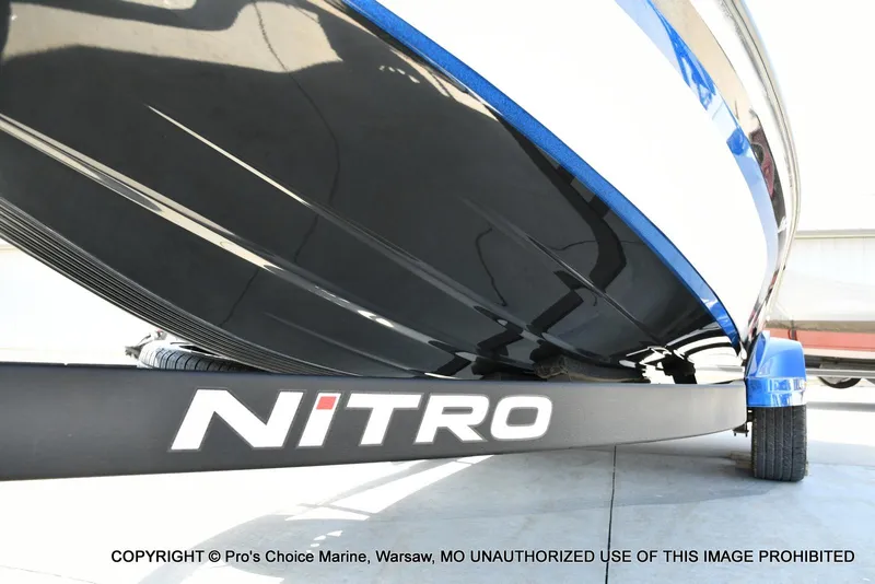 Slide: The Image of 2023 Nitro Z21 XL Pro boat on trailer, close-up view. - 35