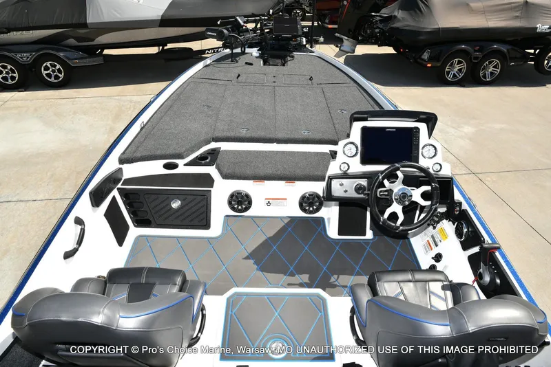 Slide: The Image of 2023 Nitro Z21 XL Pro boat interior with modern dashboard and seating. - 43
