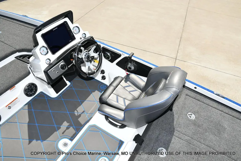 Slide: The Image of 2023 Nitro Z21 XL Pro boat cockpit with steering wheel and seating. - 45
