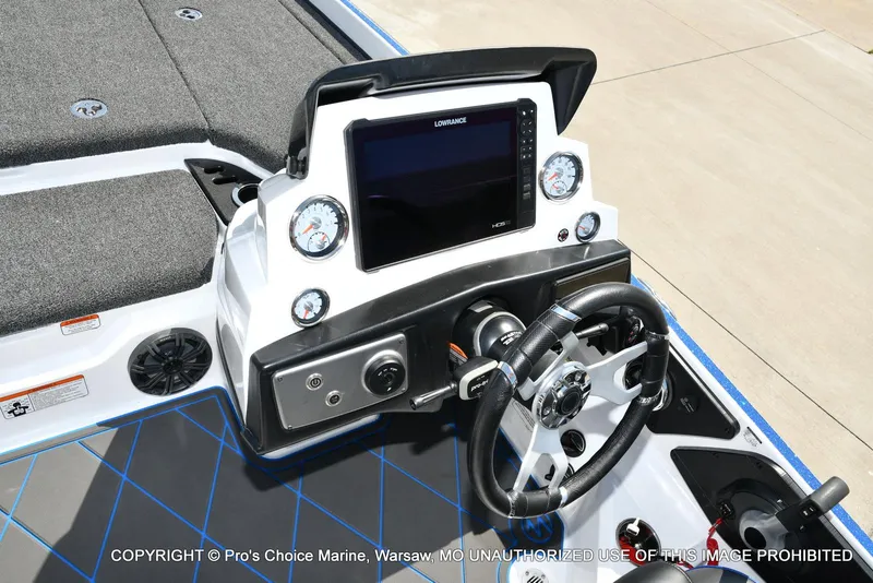 Slide: The Image of 2023 Nitro Z21 XL Pro boat dashboard with steering wheel and electronic display. - 46