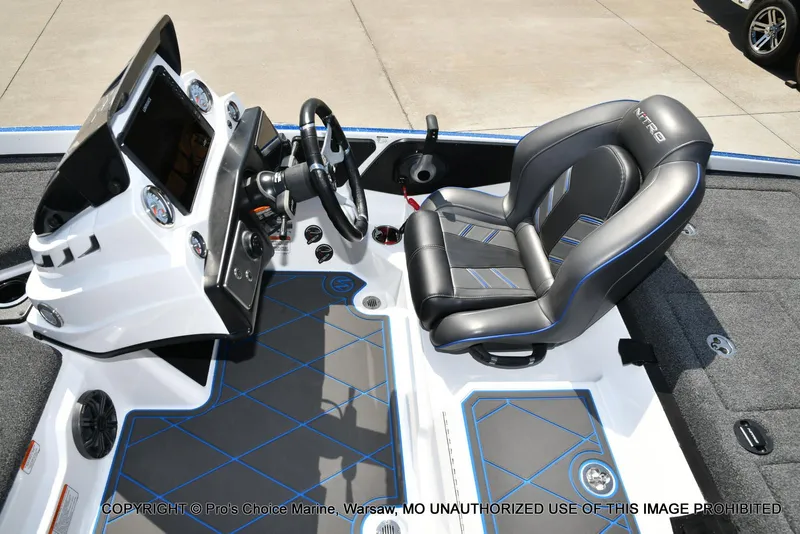 Slide: The Image of 2023 Nitro Z21 XL Pro boat interior with steering console and cushioned seat. - 47