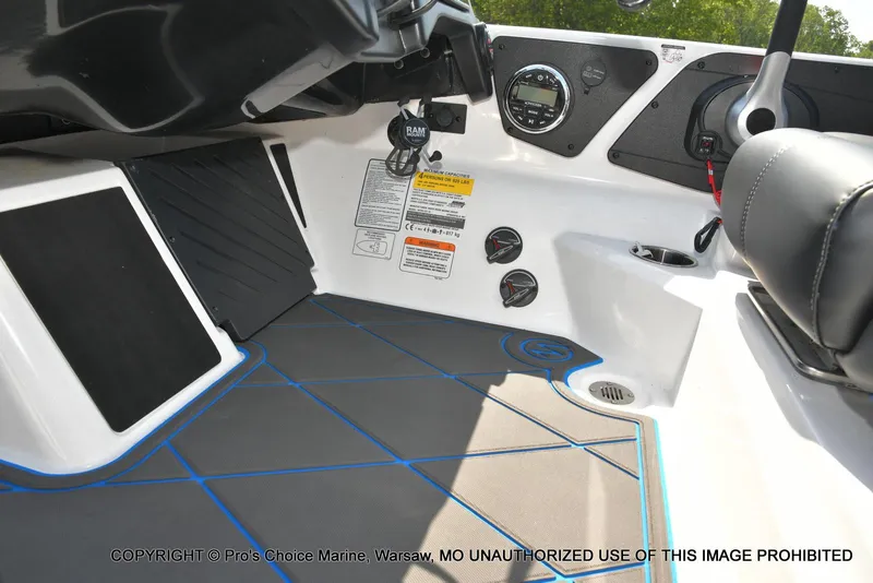 Slide: The Image of 2023 Nitro Z21 XL Pro boat interior with control panel and seating area. - 48