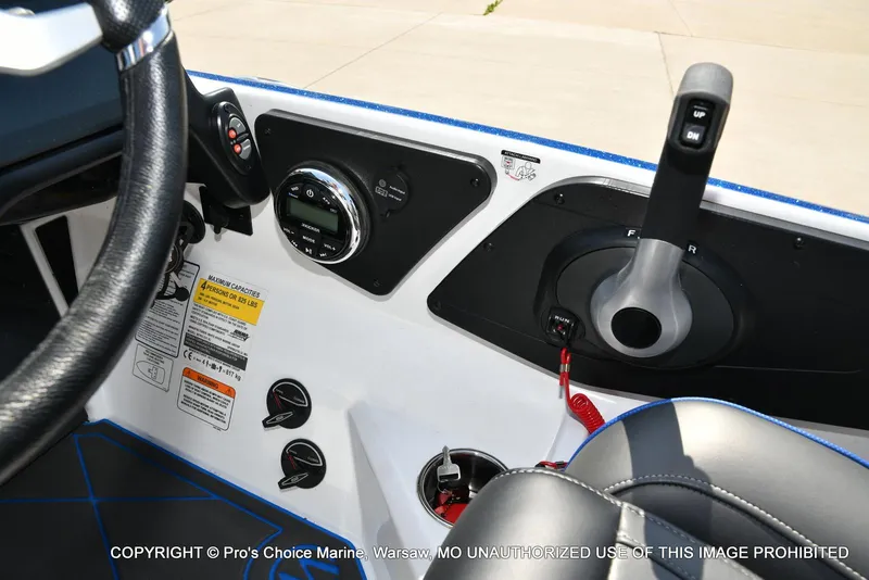 Slide: The Image of 2023 Nitro Z21 XL Pro boat dashboard with steering wheel and control panel. - 49