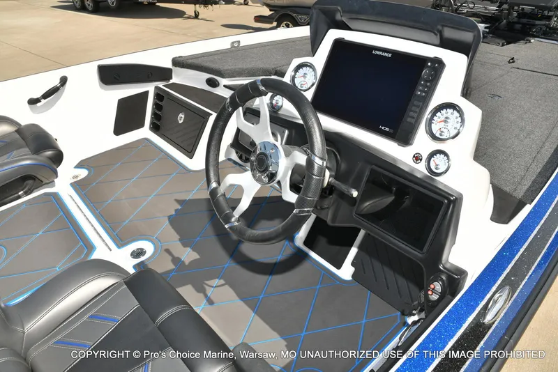 Slide: The Image of 2023 Nitro Z21 XL Pro boat cockpit with steering wheel and digital display. - 6