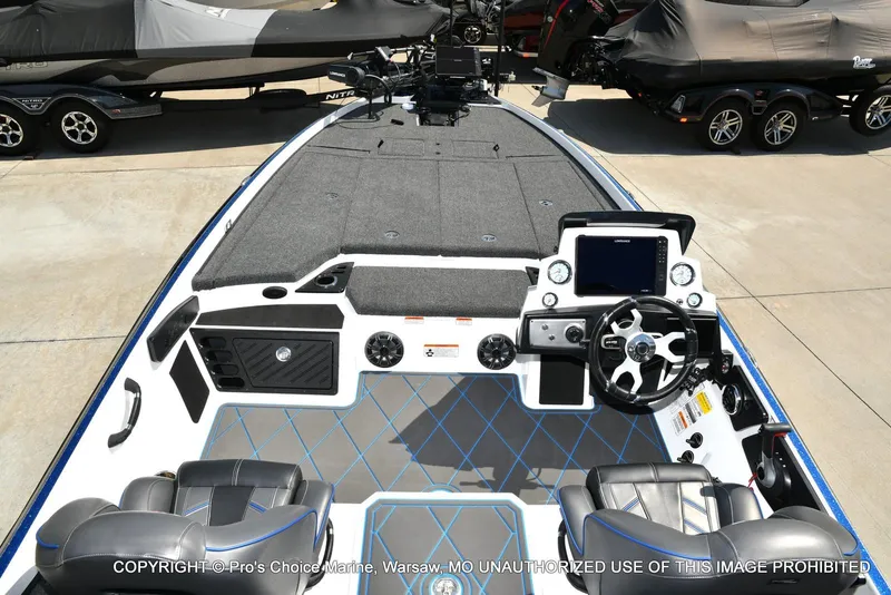 Slide: The Image of 2023 Nitro Z21 XL Pro boat interior with modern dashboard and seating. - 8