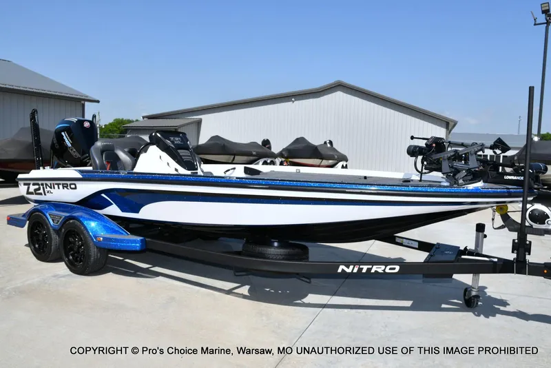 Slide: The Image of 2023 Nitro Z21 XL Pro boat on trailer, parked outdoors. - 81