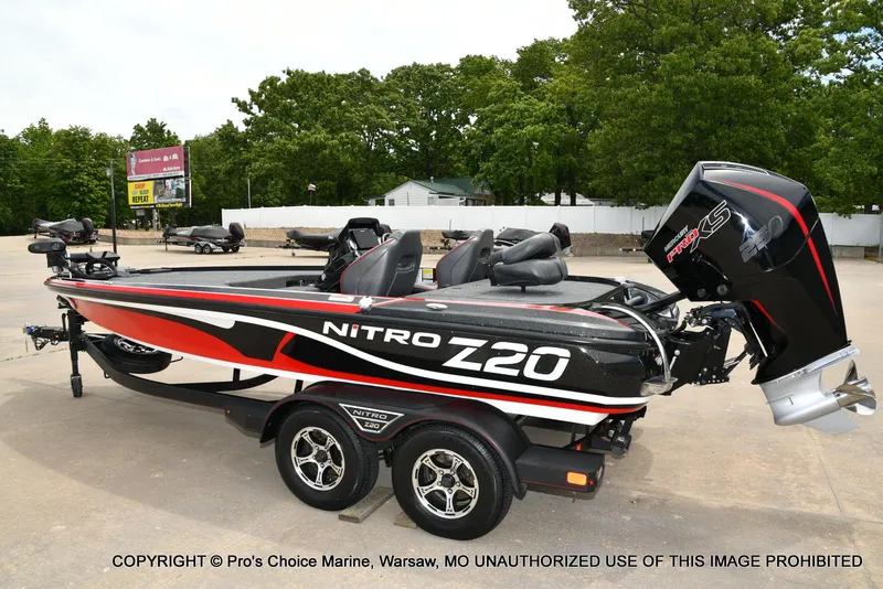 Slide: The Image of 2020 Nitro Z20 Pro boat with 250 Pro-XS 4 Stroke engine, parked outdoors. - 28
