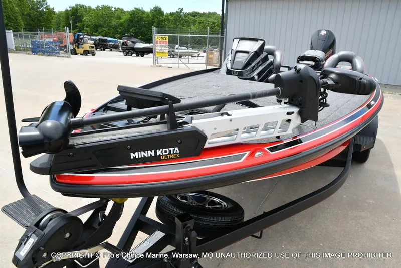 Slide: The Image of 2020 Nitro Z20 Pro boat with Minn Kota Ultrex trolling motor, parked outdoors. - 31