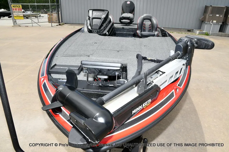 Slide: The Image of 2020 Nitro Z20 Pro boat with Minn Kota Ultrex motor, parked outdoors. - 32