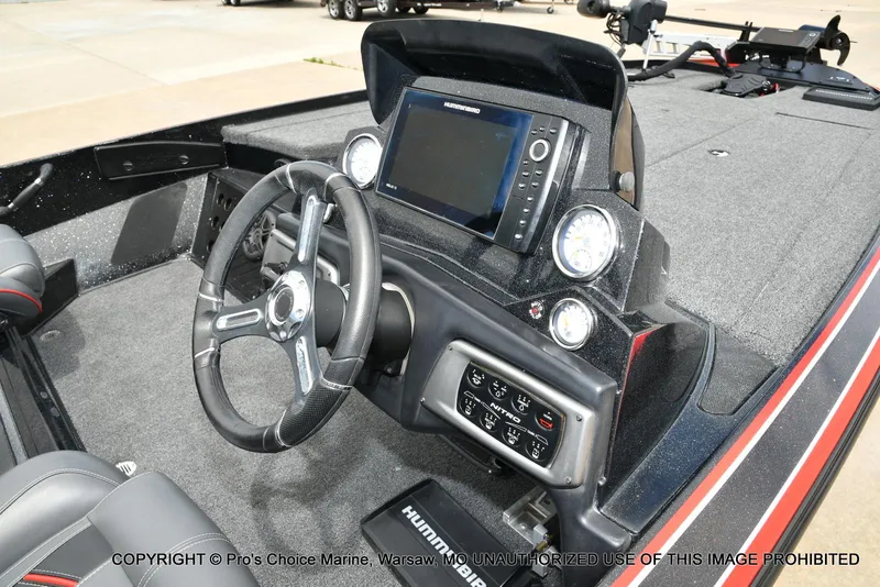 Slide: The Image of 2020 Nitro Z20 Pro boat dashboard with steering wheel and electronic display. - 41
