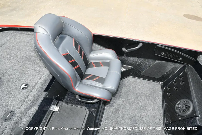 Slide: The Image of 2020 Nitro Z20 Pro boat interior with gray and red seat, carpeted flooring. - 48