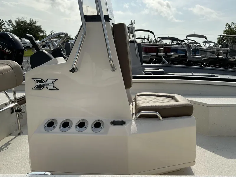 Slide: The Image of 2025 Xpress Hyper-Lift Series H22B boat interior with seating and control panel. - 3