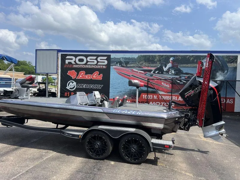 Slide: The Image of 2022 Blazer 650 Pro Tour boat on trailer at Ross Motorsports dealership. - 11