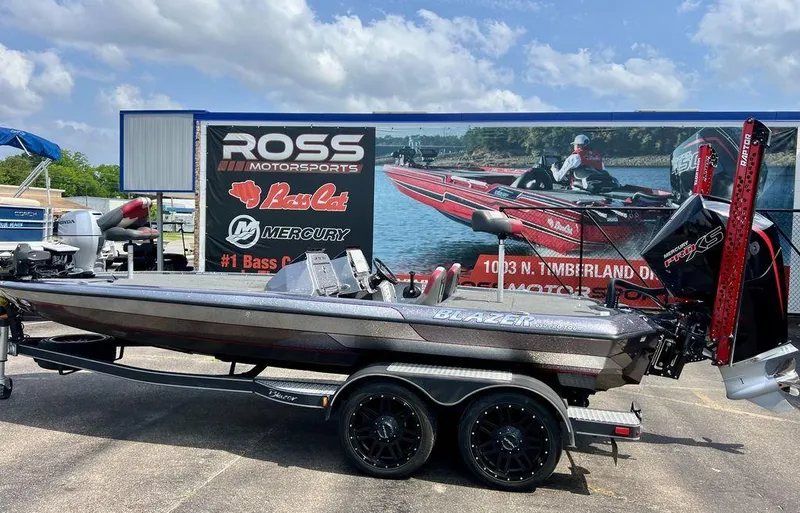 Slide: The Image of 2022 Blazer 650 Pro Tour boat at Ross Motorsports dealership, featuring Mercury engine. - 12