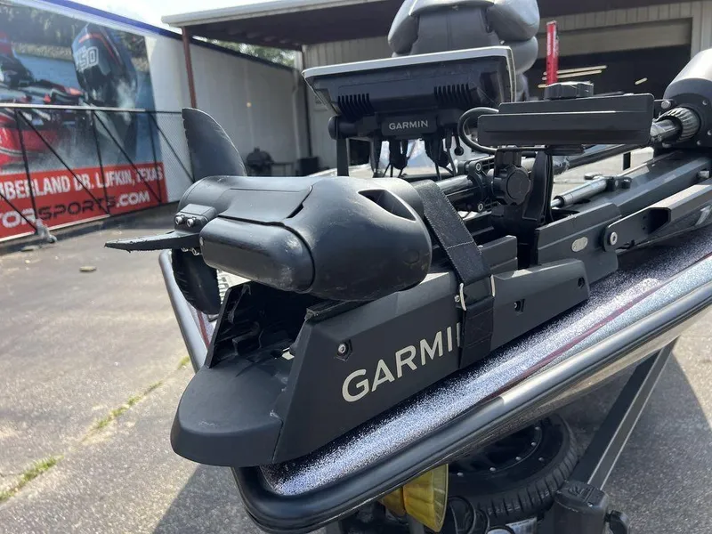 Slide: The Image of 2022 Blazer 650 Pro Tour with Garmin equipment, parked outdoors near a motorsport facility. - 25