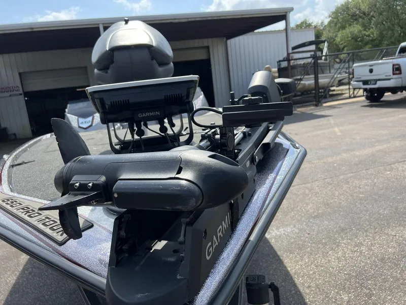 Slide: The Image of 2022 Blazer 650 Pro Tour boat with Garmin equipment, parked outside a garage. - 30
