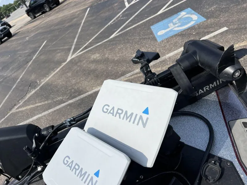 Slide: The Image of Garmin devices on a 2022 Blazer 650 Pro Tour in a parking lot. - 32