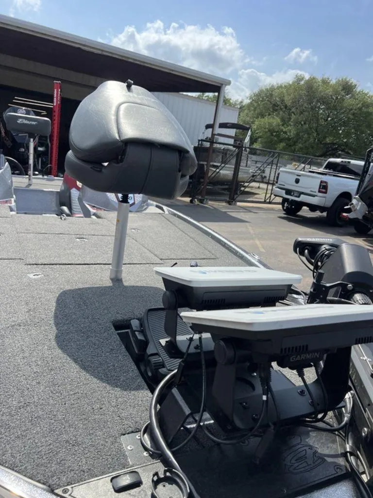 Slide: The Image of 2022 Blazer 650 Pro Tour boat with Garmin electronics and seating, parked outdoors. - 38