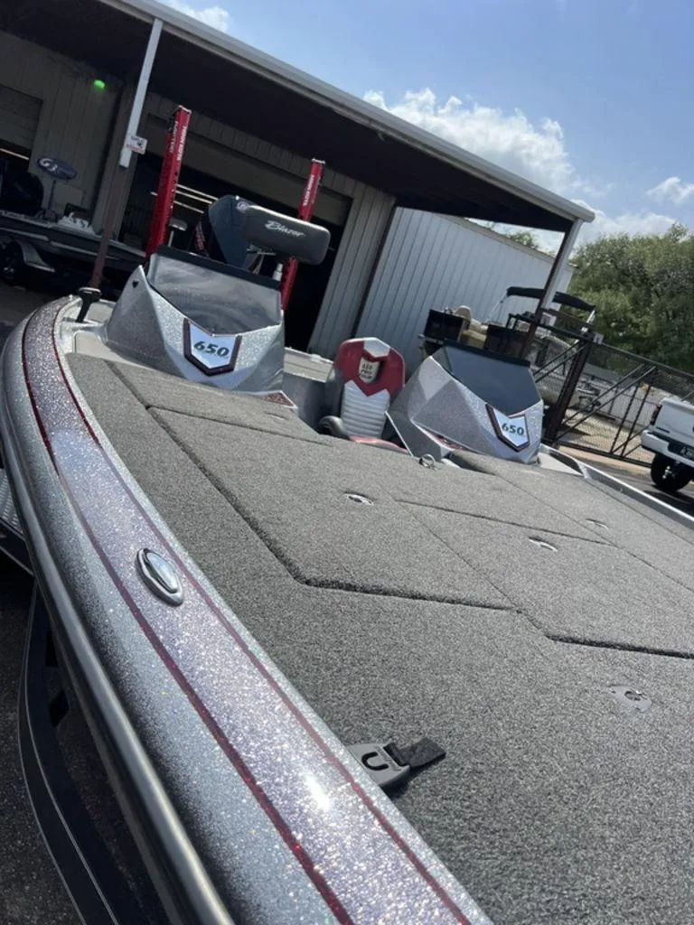 Slide: The Image of 2022 Blazer 650 Pro Tour boat with spacious deck and dual consoles. - 40