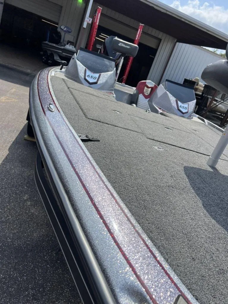 Slide: The Image of 2022 Blazer 650 Pro Tour boat with sleek design and spacious deck. - 41