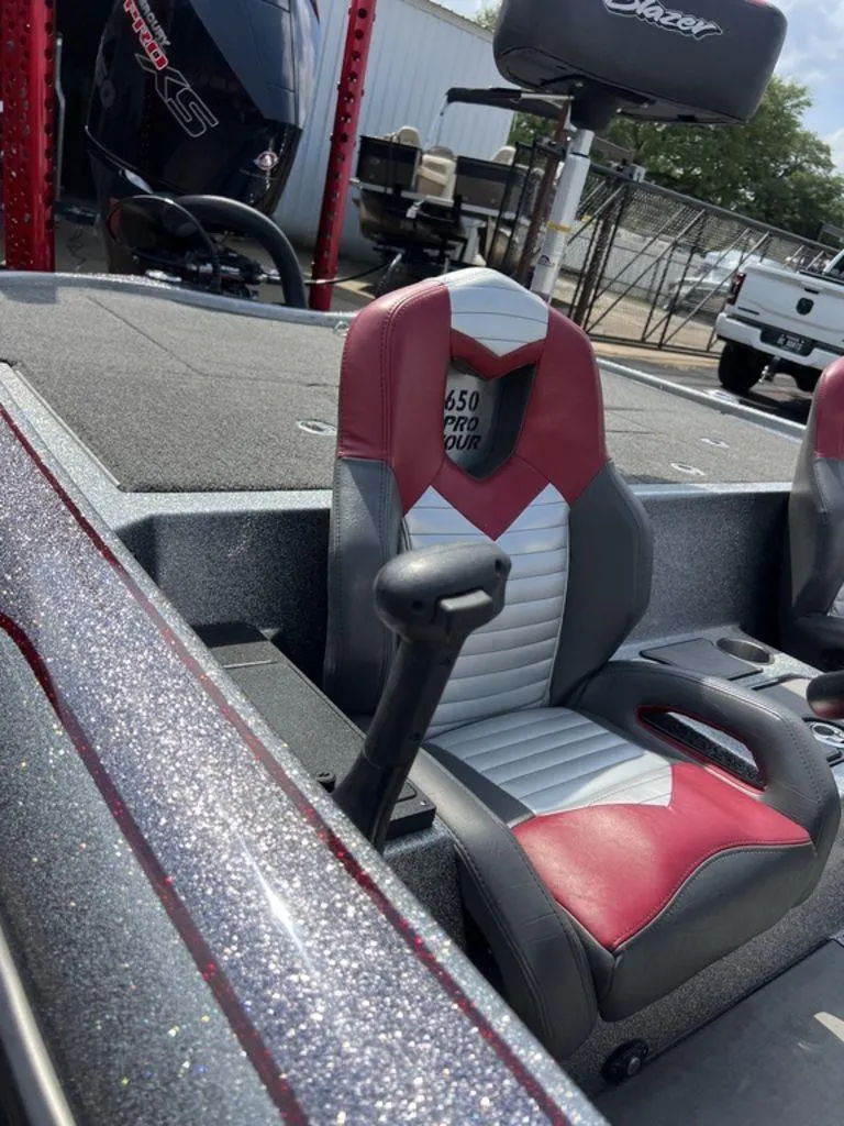 Slide: The Image of 2022 Blazer 650 Pro Tour boat interior with red and gray seating. - 47