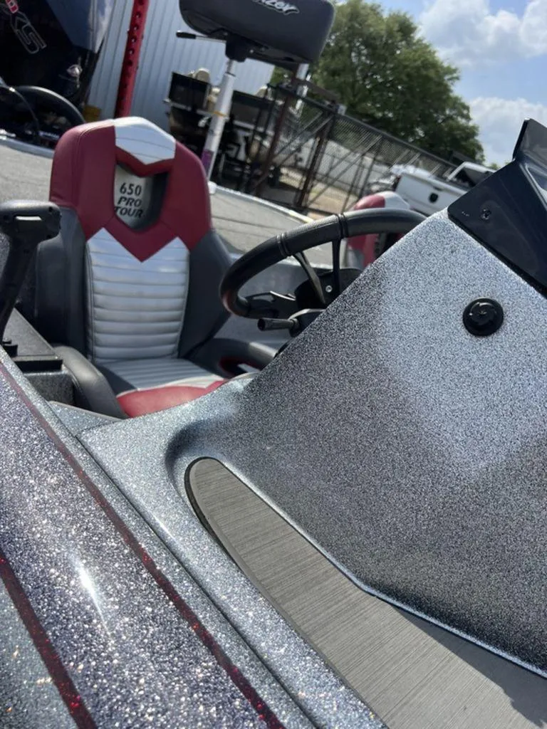 Slide: The Image of 2022 Blazer 650 Pro Tour boat interior with glitter finish and red-white seating. - 48