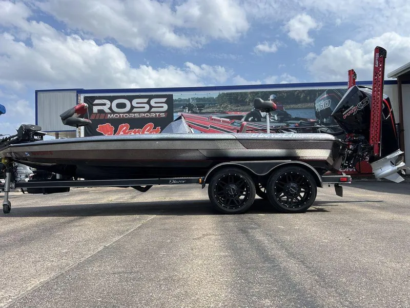 Slide: The Image of 2022 Blazer 650 Pro Tour boat at Ross Motorsports dealership under a cloudy sky. - 9