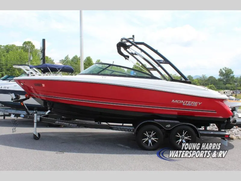 Slide: The Image of 2023 Monterey 224 FS/BR boat in vibrant red on trailer at Young Harris Watersports. - 1