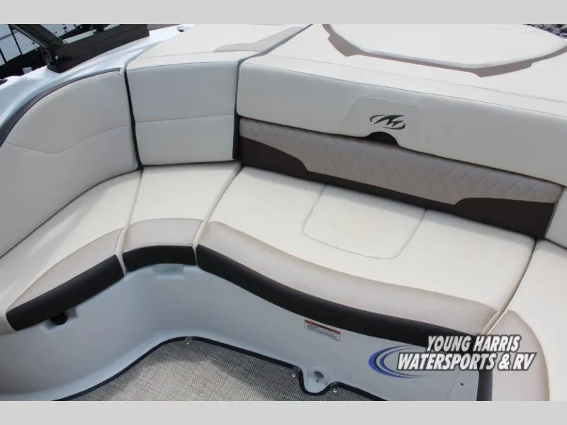 Slide: The Image of 2023 Monterey 224 FS/BR boat interior seating with beige and brown upholstery. - 10