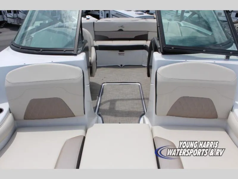 Slide: The Image of 2023 Monterey 224 FS/BR boat interior with beige seating and open deck layout. - 13