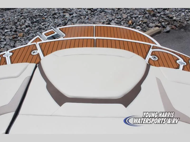 Slide: The Image of 2023 Monterey 224 FS/BR boat with sleek deck design and cushioned seating. - 6