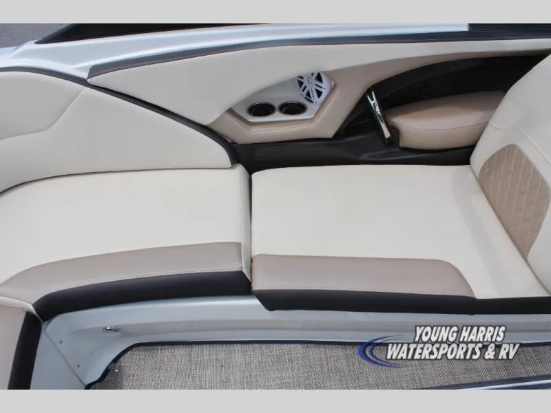 Slide: The Image of 2023 Monterey 224 FS/BR boat interior with beige seating and cup holders. - 9